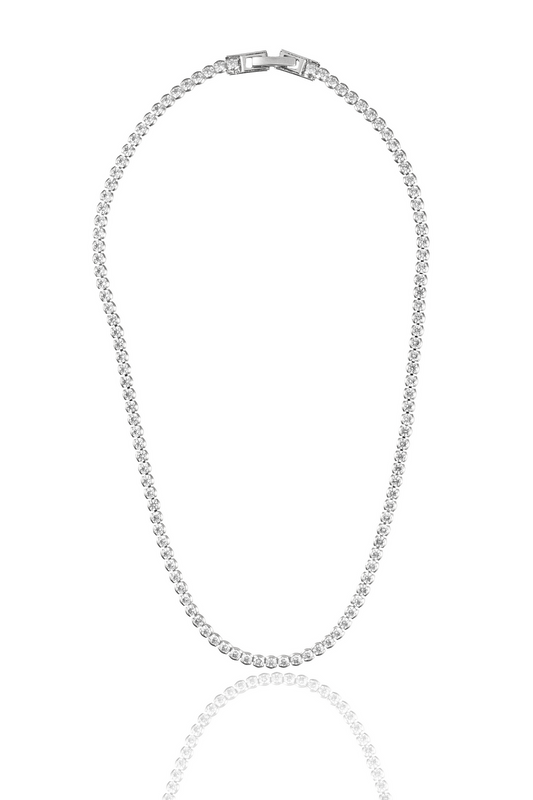 A sparkling silver tennis necklace with a secure clasp lies against a clean white background.