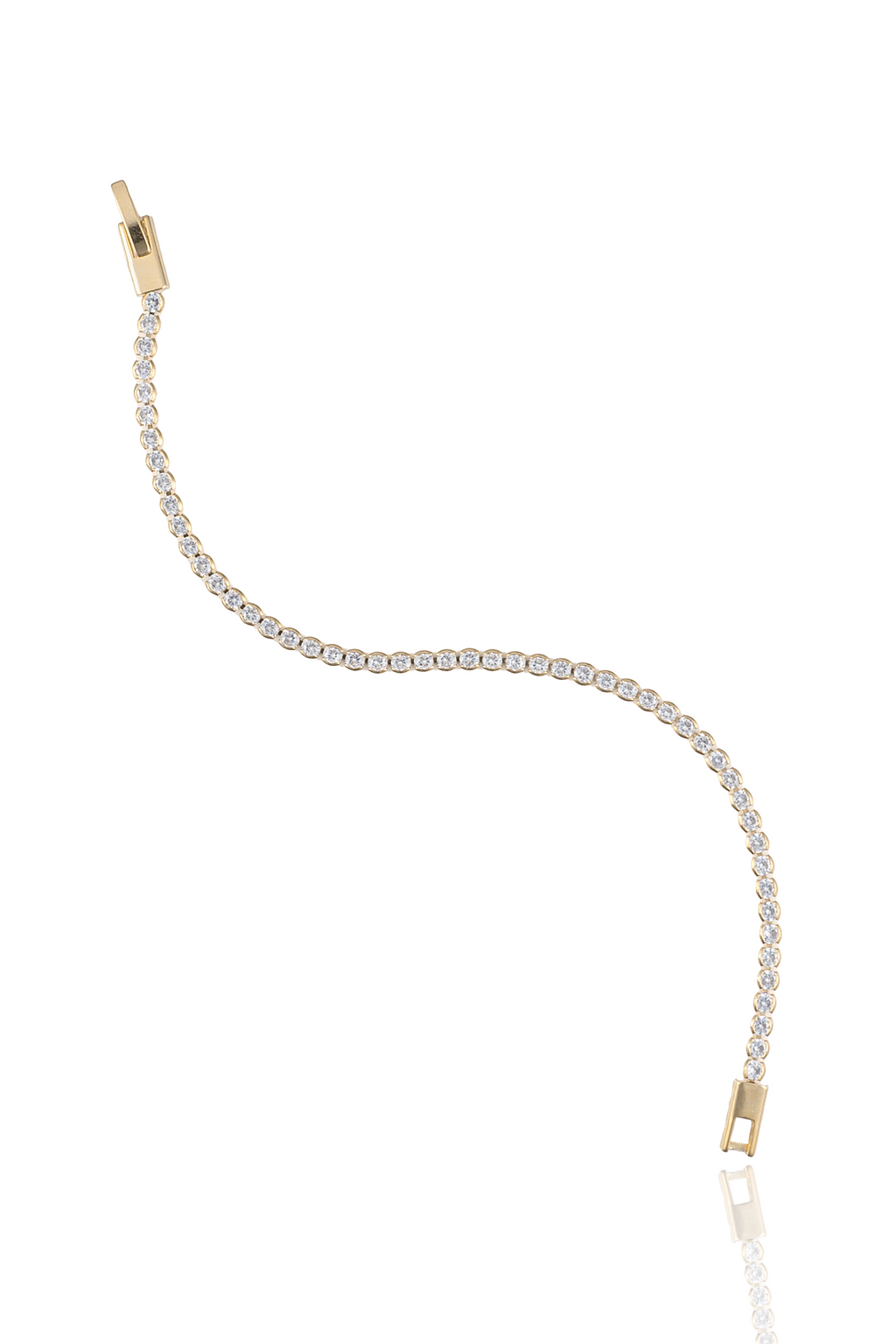 A delicate gold tennis bracelet sparkles with a continuous line of round diamonds against a white background.