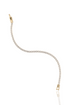 A delicate gold tennis bracelet sparkles with a continuous line of round diamonds against a white background.