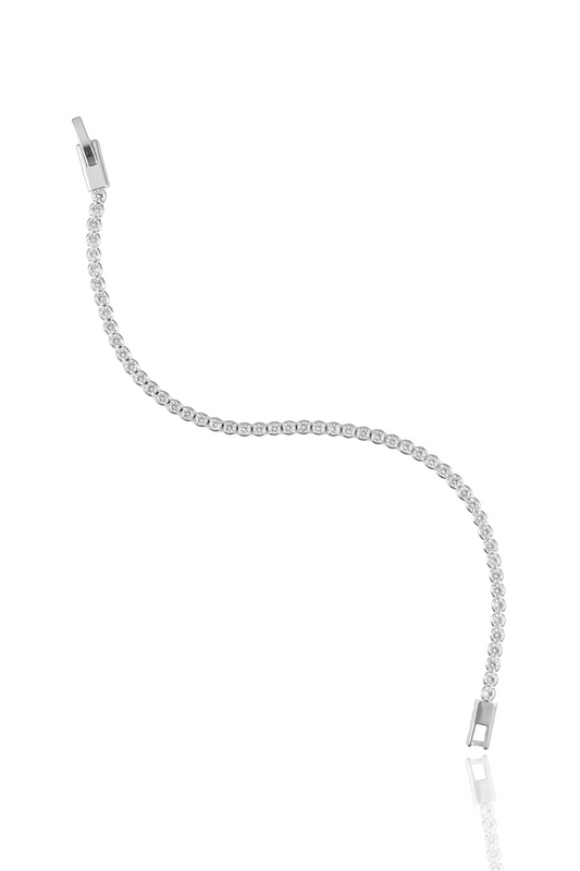 A sparkling diamond tennis bracelet curves gracefully against a plain white background.