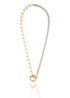 A gold toggle necklace features a chunky paperclip chain on one side and a dazzling line of baguette-cut diamonds on the other.