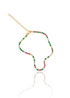 A gold tennis necklace sparkles with vibrant multi-colored cubic zirconia stones against a clean white background.
