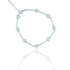 A sparkling silver star tennis bracelet with pavé-set rhinestones lies against a white background, casting a soft reflection below.