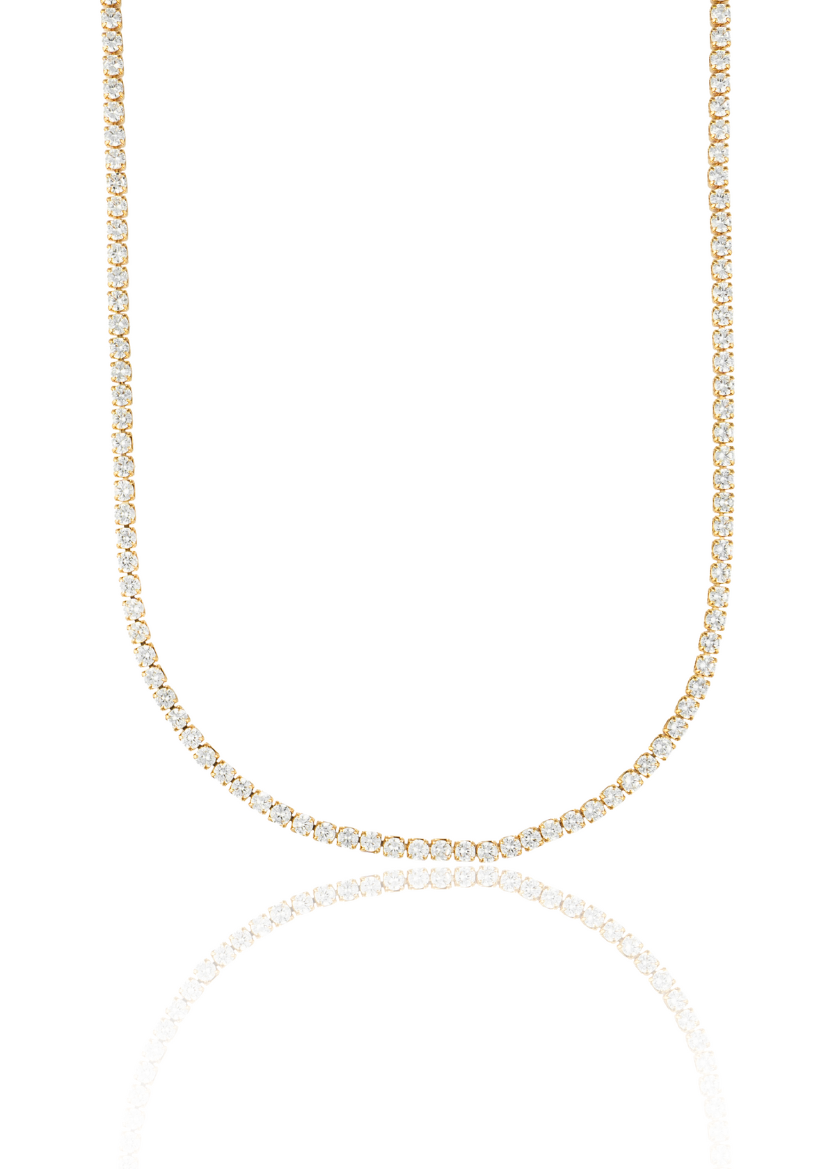 A sparkling gold tennis necklace with a continuous line of diamonds drapes gracefully against a clean white background, reflecting softly on the surface below.