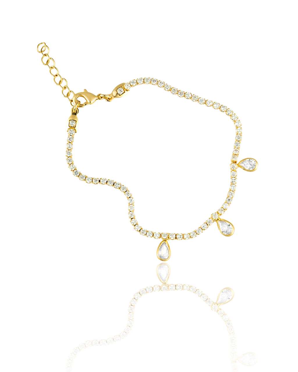A gold tennis bracelet sparkles against a white background, featuring dangling pear-shaped diamond charms and an adjustable chain.