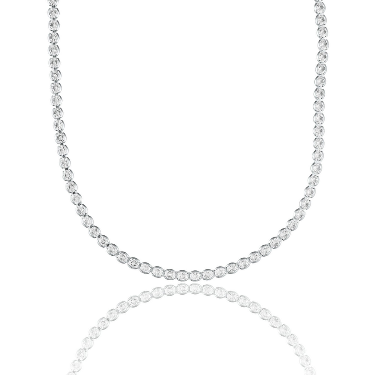 A sparkling diamond tennis necklace rests against a clean white background, reflecting its brilliance in a subtle mirror surface below.