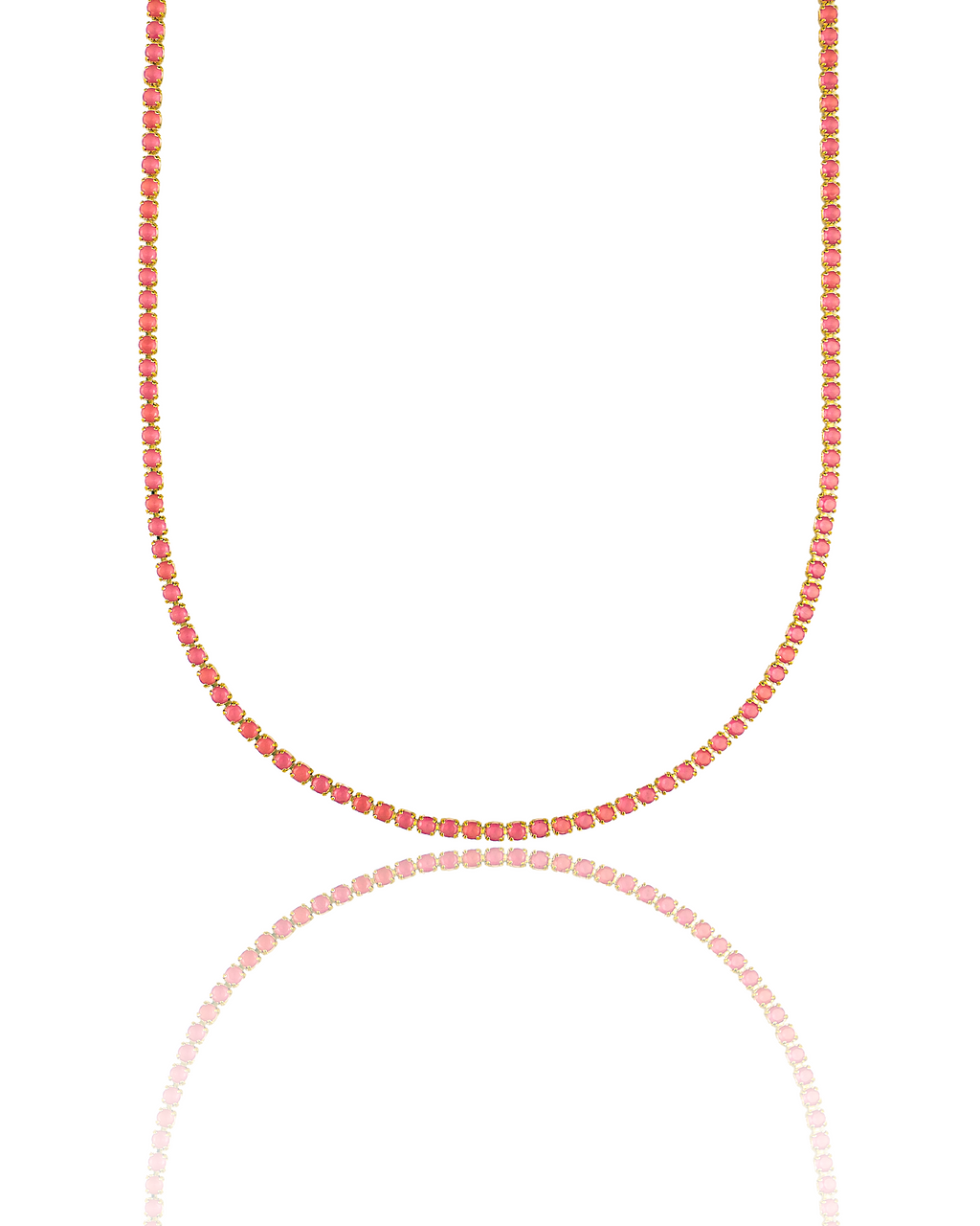 A delicate gold tennis necklace features a continuous line of vibrant pink gemstones against a clean white background.