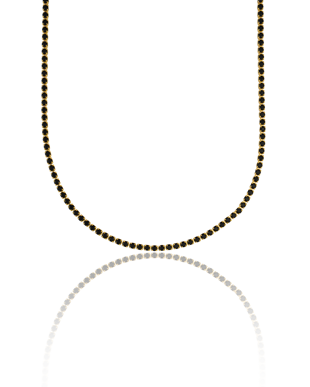 A stunning gold tennis necklace features a continuous line of sparkling black stones, displayed upright against a clean white background with a subtle reflection.