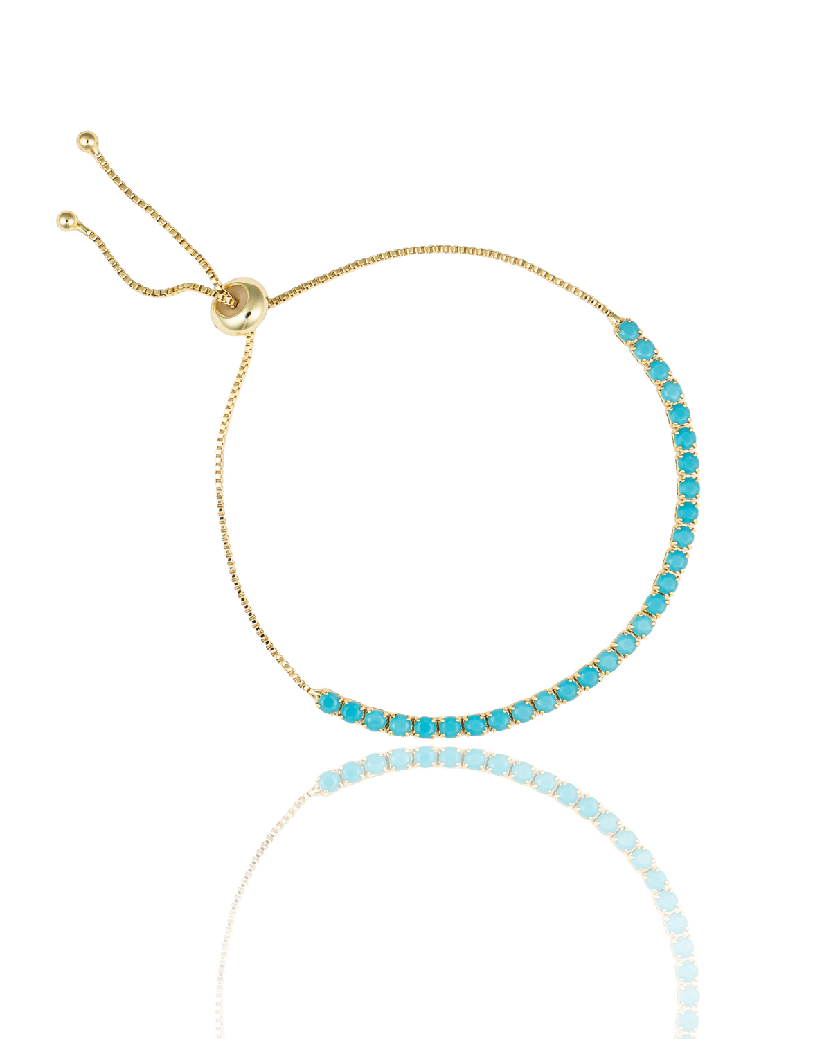 A delicate gold slider bracelet features a sparkling row of vibrant turquoise gemstones.