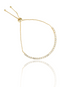 A delicate gold bolo tennis bracelet sparkles with cubic zirconia stones against a white background.