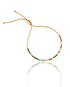 A delicate gold adjustable bolo tennis bracelet sparkles with a vibrant array of multicolored cubic zirconia stones against a clean white background.