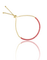 A gold bolo tennis bracelet features a curved line of vibrant pink gemstones against a white background.