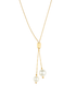 A delicate gold-beaded lariat necklace features a cylindrical slider and two dangling white pearls against a clean white background.