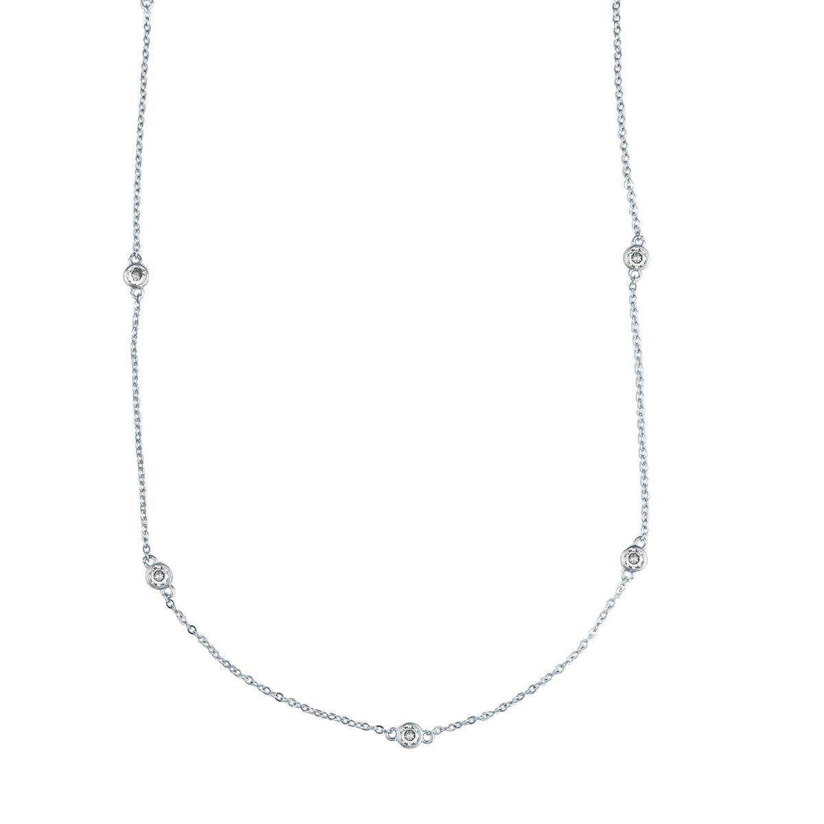 A delicate white gold diamond station necklace hangs against a white background, featuring bezel-set round diamonds spaced evenly along the fine chain.