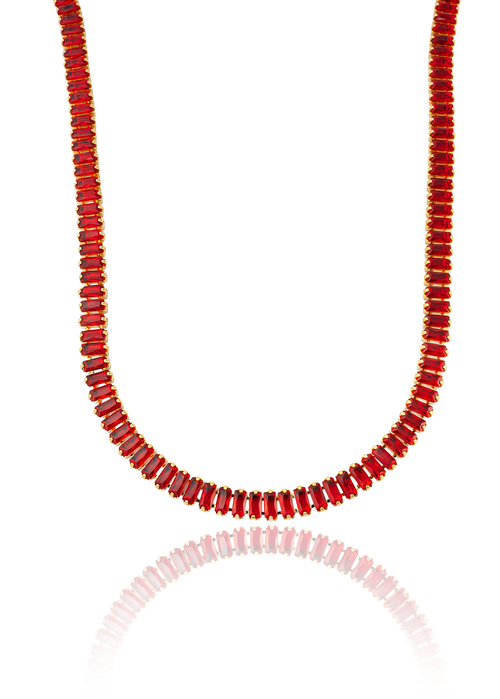 A gold tennis necklace featuring vibrant red baguette-cut crystals displays its sparkling reflection against a clean white background.