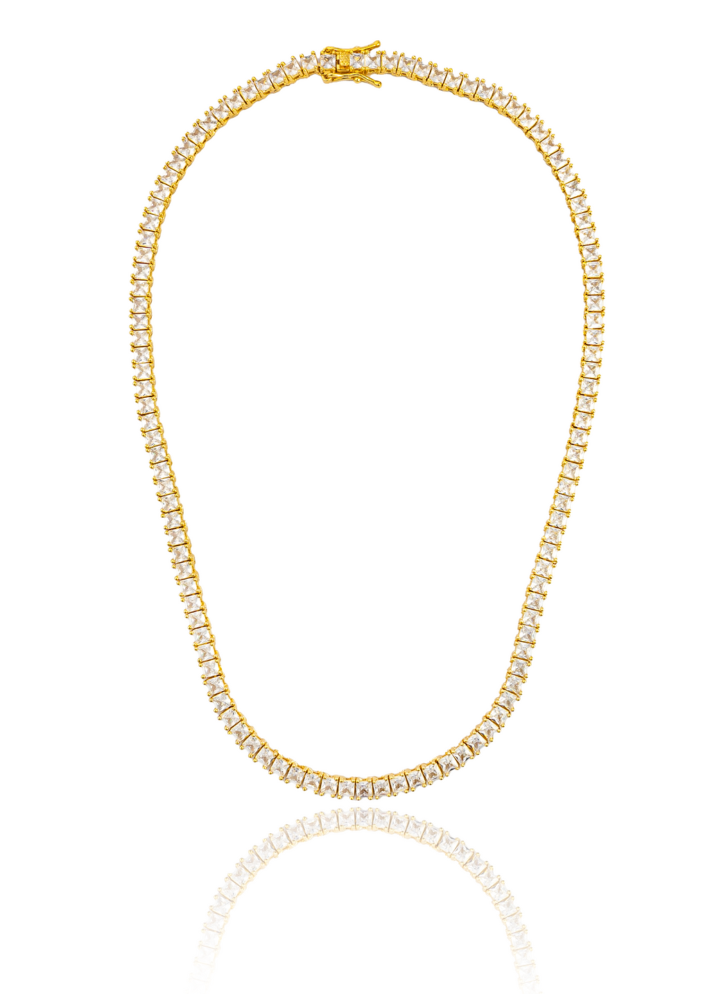 A sparkling gold tennis necklace features square-cut cubic zirconia stones and rests in a circular display with a clear reflection below.