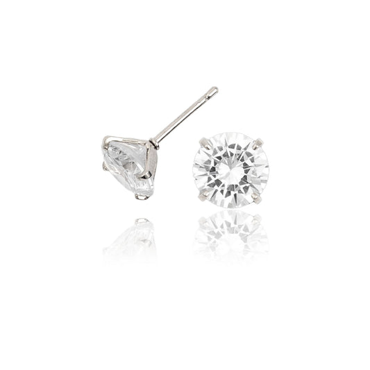 A pair of sparkling round-cut diamond stud earrings gleams against a clean white background with a soft reflection underneath.