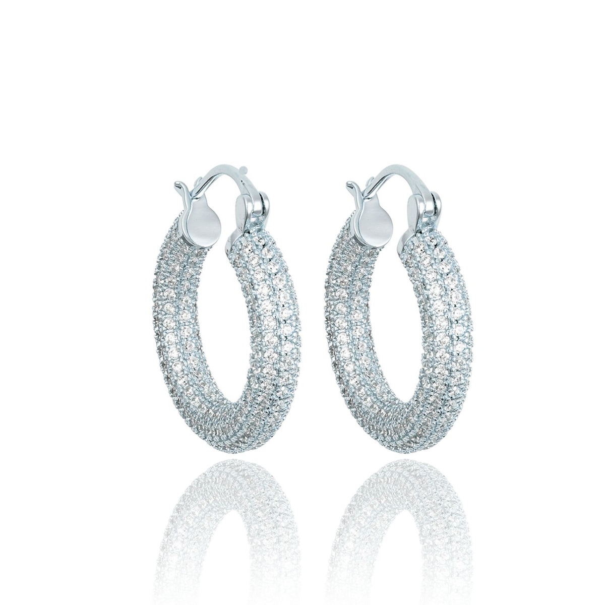 A pair of sparkling pave huggie hoop earrings glitters against a clean white background.