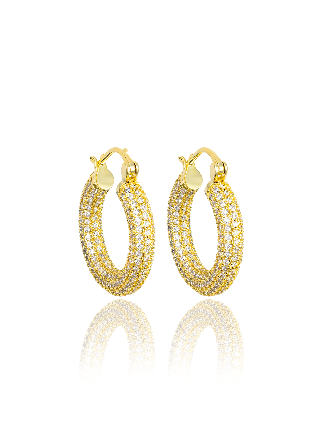 A pair of gold pave-set diamond hoop earrings sparkles against a clean white background with a soft reflection underneath.