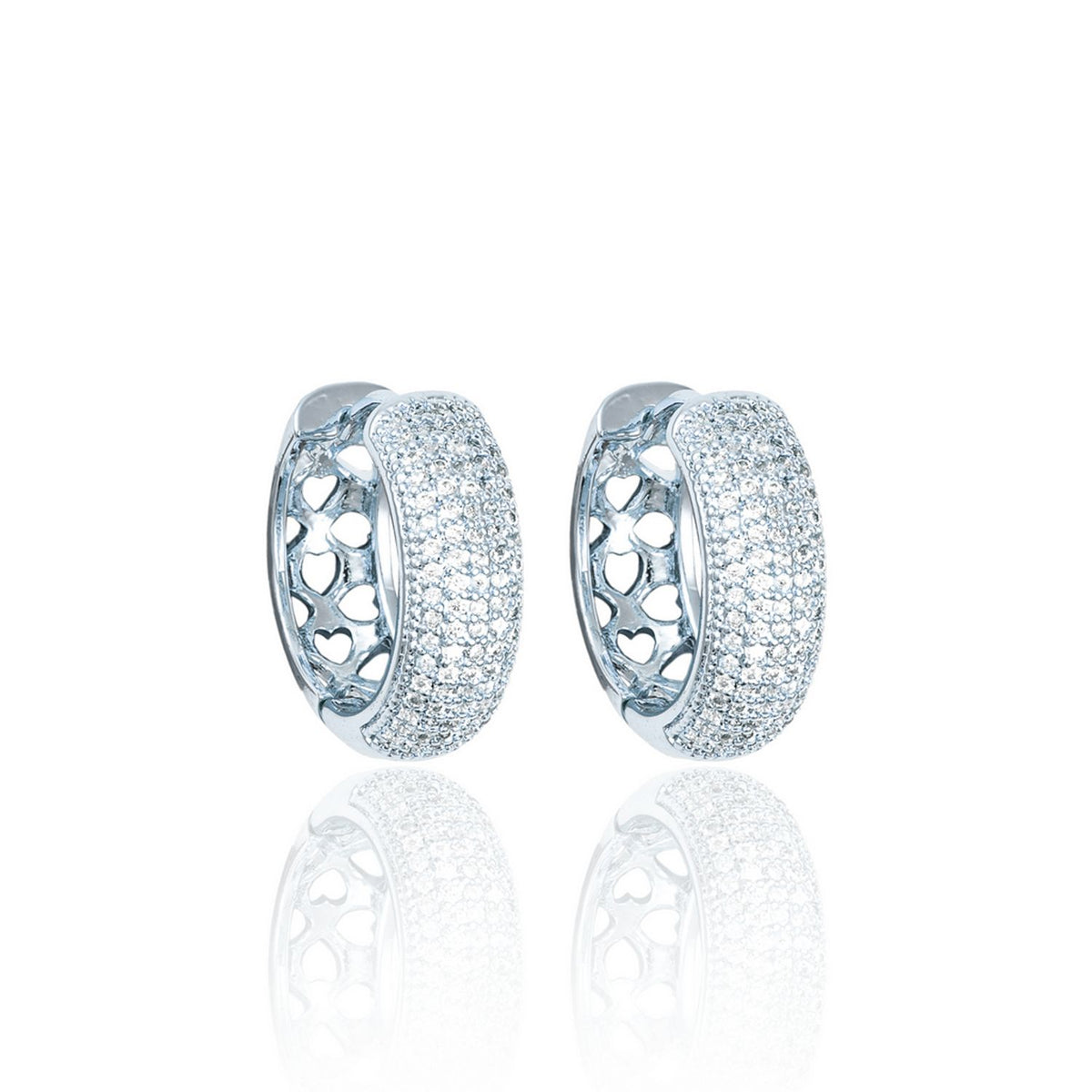 A pair of silver huggie hoop earrings featuring pavé-set diamonds and delicate cutout hearts on the sides.