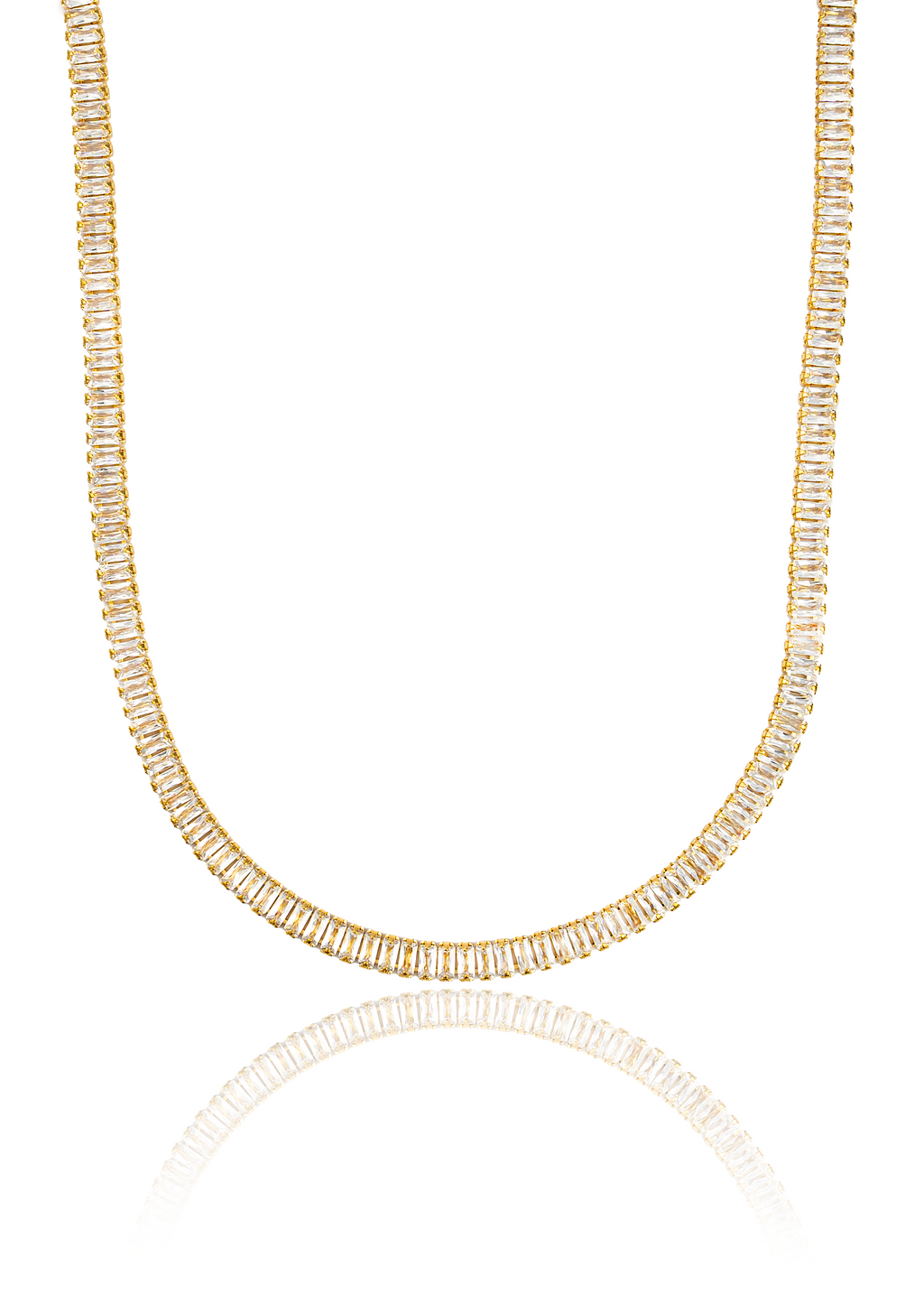 A gold tennis necklace featuring sparkling baguette-cut cubic zirconia stones drapes in a U-shape against a clean white background.