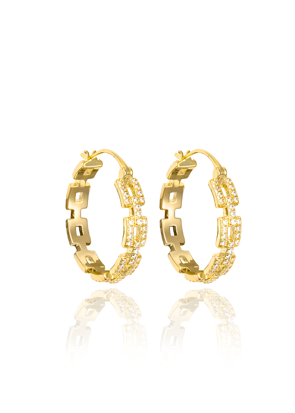 A pair of gold geometric hoop earrings embellished with sparkling cubic zirconia stones stands against a clean white background.