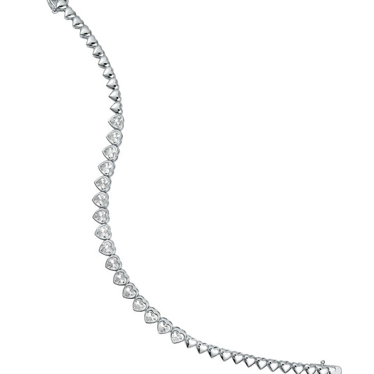 A sparkling silver tennis bracelet made of interlocking heart-shaped cubic zirconia stones curves gracefully against a white background.