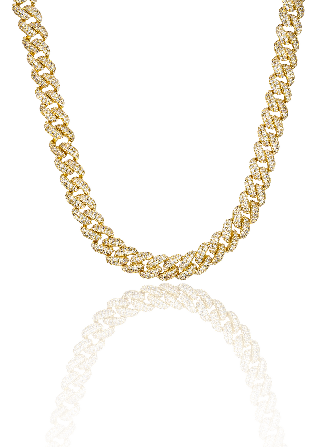 A sparkling diamond-pave gold cuban link chain rests against a clean white background, reflecting its dazzling design below.