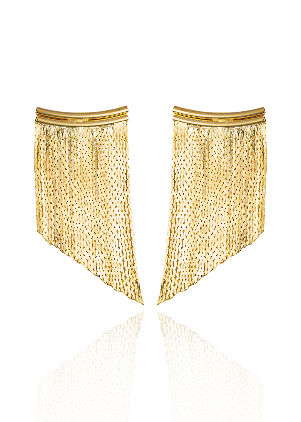 A pair of sleek gold fringe earrings gleams against a clean white background, reflecting softly on a polished surface.
