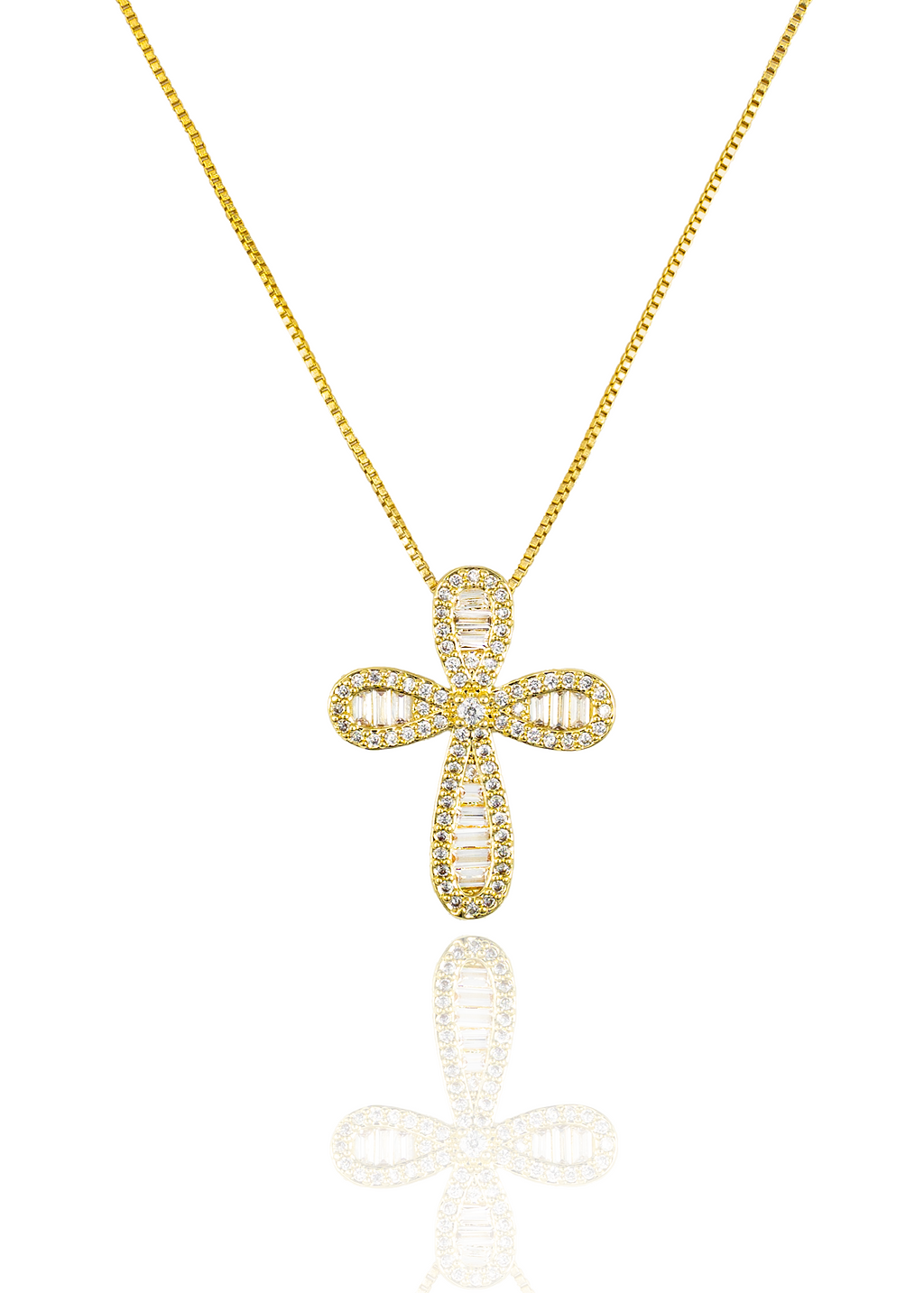 A sparkling diamond-encrusted gold cross pendant hangs from a delicate box chain against a white background.