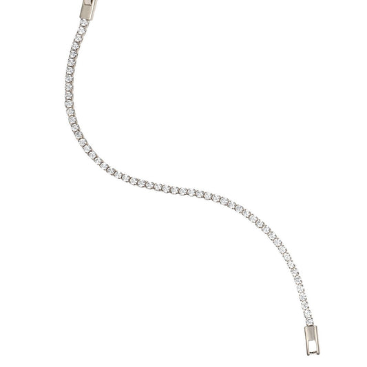 A delicate diamond tennis bracelet curves across a clean white background, showcasing a continuous line of sparkling round-cut stones set in white gold.