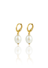 A pair of elegant gold hoop earrings featuring dangling white baroque pearls are displayed against a clean white background with a soft reflection below.