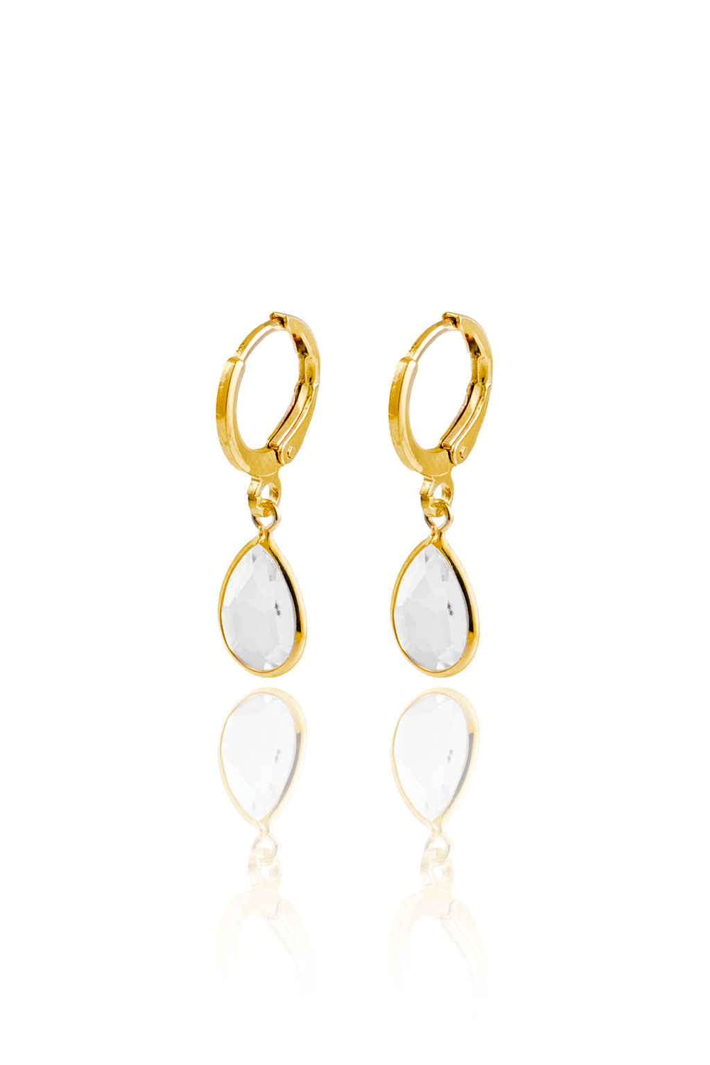 A pair of elegant gold hoop earrings features dangling teardrop-shaped white crystal charms against a clean white background.