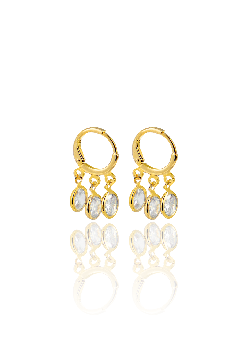 A pair of gleaming gold hoop earrings feature three dangling oval crystal charms against a clean white background.