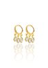 A pair of gleaming gold hoop earrings feature three dangling oval crystal charms against a clean white background.