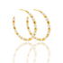 A pair of elegant gold hoop earrings adorned with alternating white pearls and textured gold beads sparkles against a clean white background.