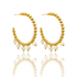 A pair of gold beaded hoop earrings featuring hanging white pearls sits against a white background with a soft reflection below.
