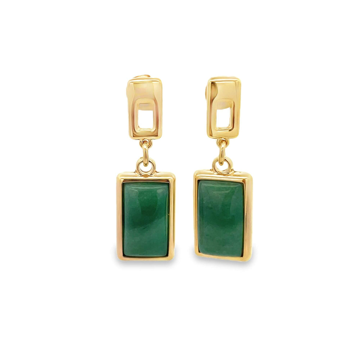 A pair of gold earrings features rectangular green jade stones hanging from geometric settings against a white background.