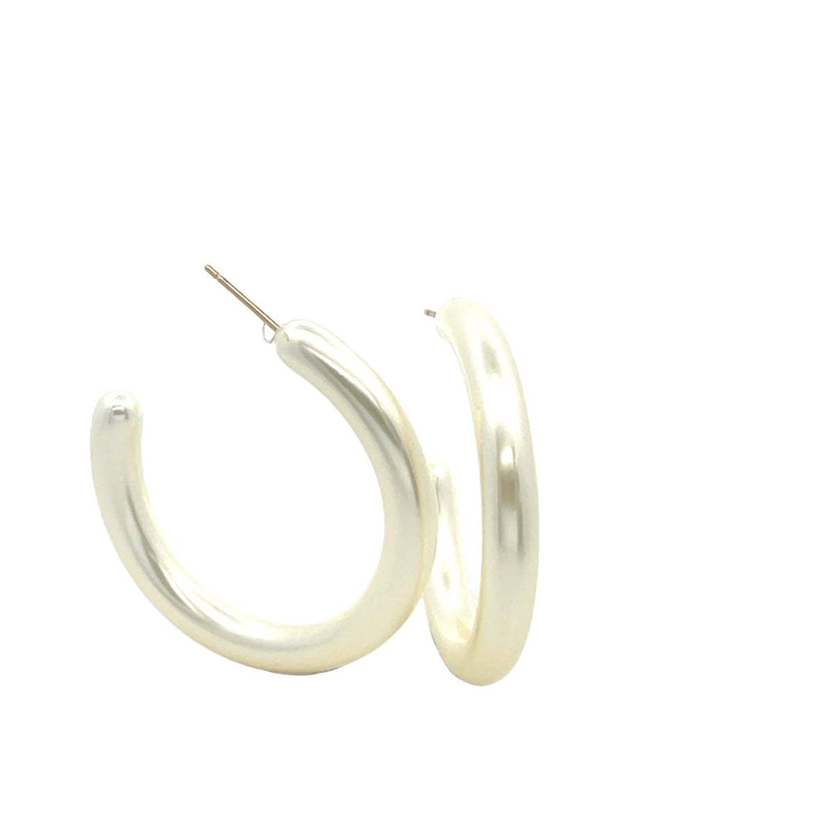A pair of thick, white pearl hoop earrings rests against a clean white background.
