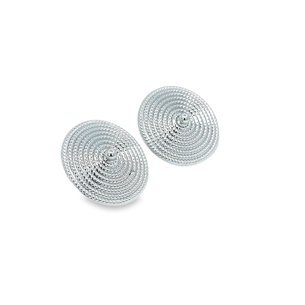 A pair of sterling silver stud earrings showcases a textured spiral design featuring concentric circles and a central bead.