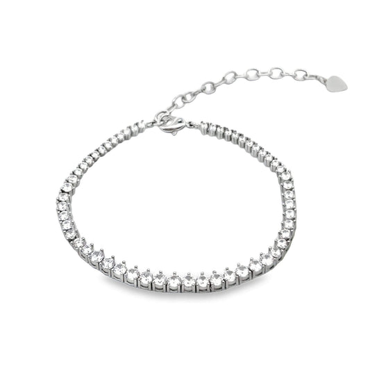 A shimmering silver tennis bracelet sparkles against a white background, featuring a continuous line of clear cubic zirconia stones and an adjustable chain.