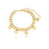 A gold cuban link charm bracelet features dangling star charms against a clean white background.