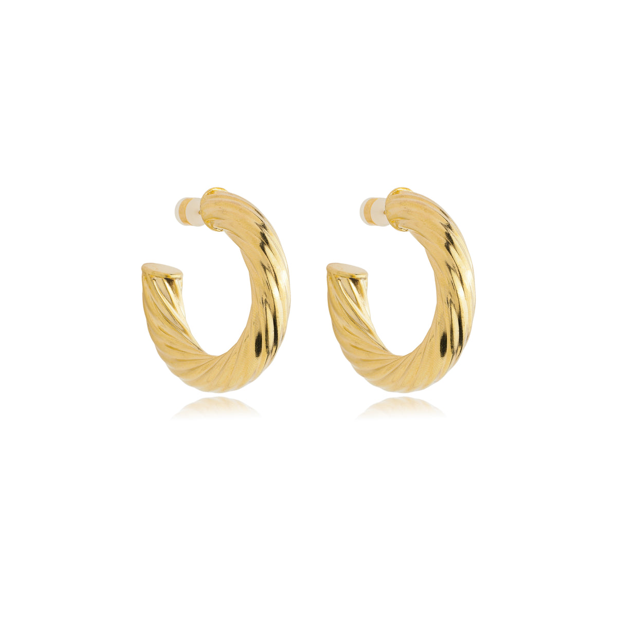 A pair of elegant twisted gold hoop earrings gleams against a clean white background.