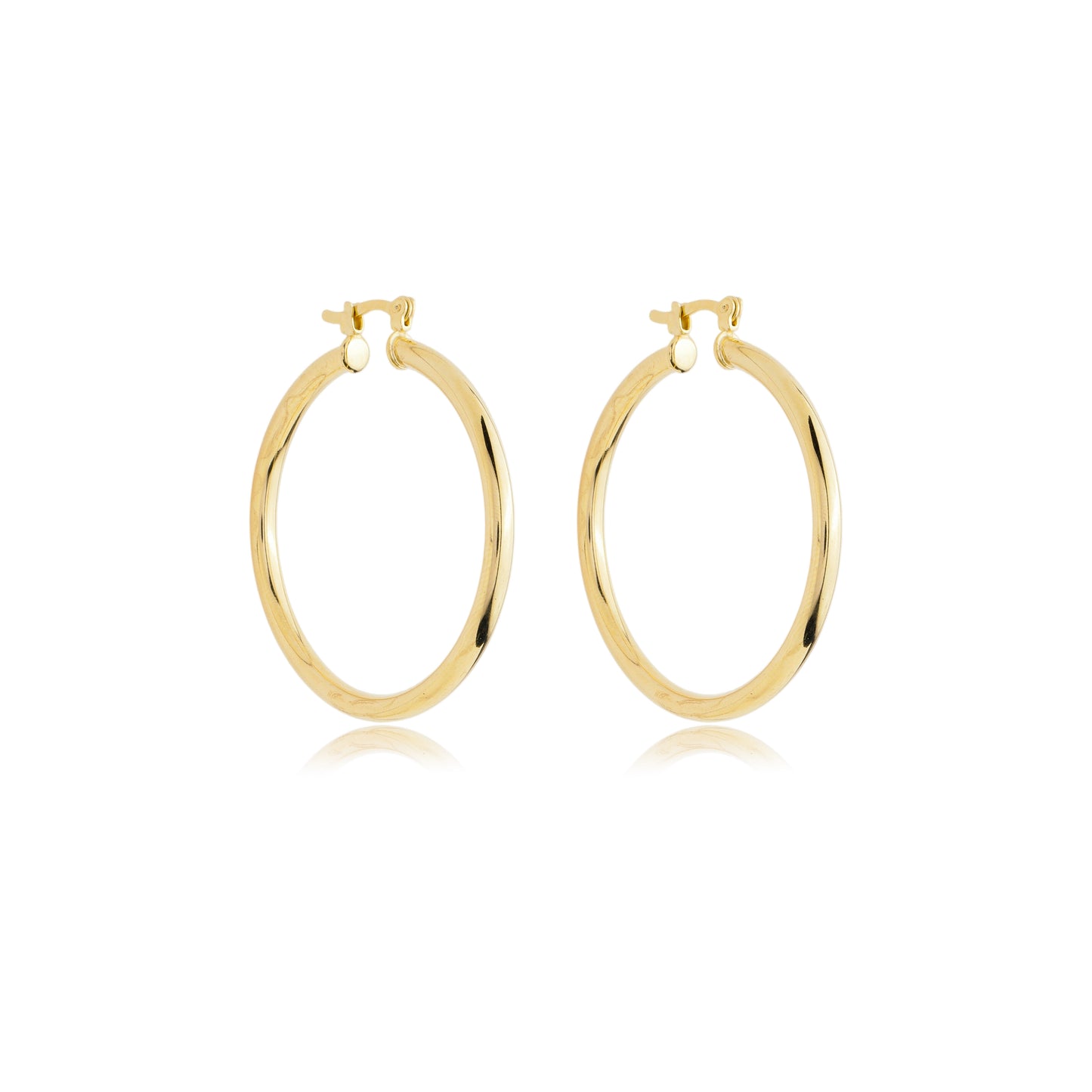 A pair of polished gold hoop earrings rests against a clean white background, showcasing their sleek, classic design.