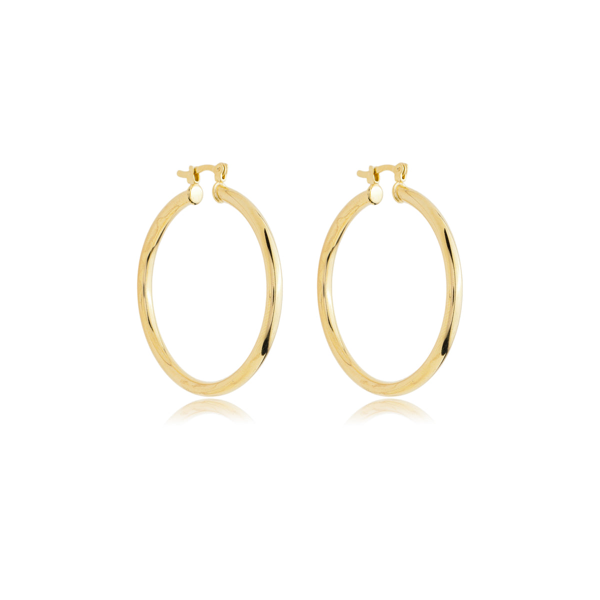 A pair of polished gold hoop earrings rests against a clean white background, showcasing their sleek, classic design.