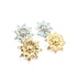 Two pairs of gold and silver sunflower-shaped earrings rest against a plain white background.
