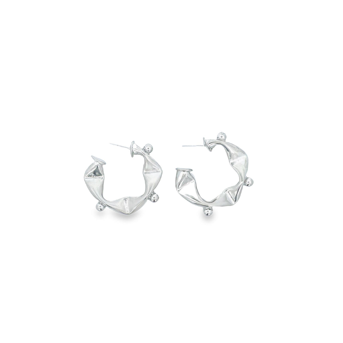 A pair of unique silver hoop earrings featuring a twisted, geometric design with small ball accents display against a clean white background.