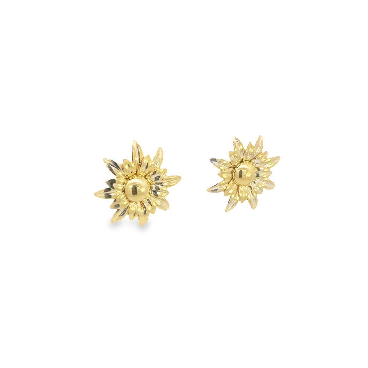 A pair of intricate gold sunburst stud earrings gleams against a clean white background.