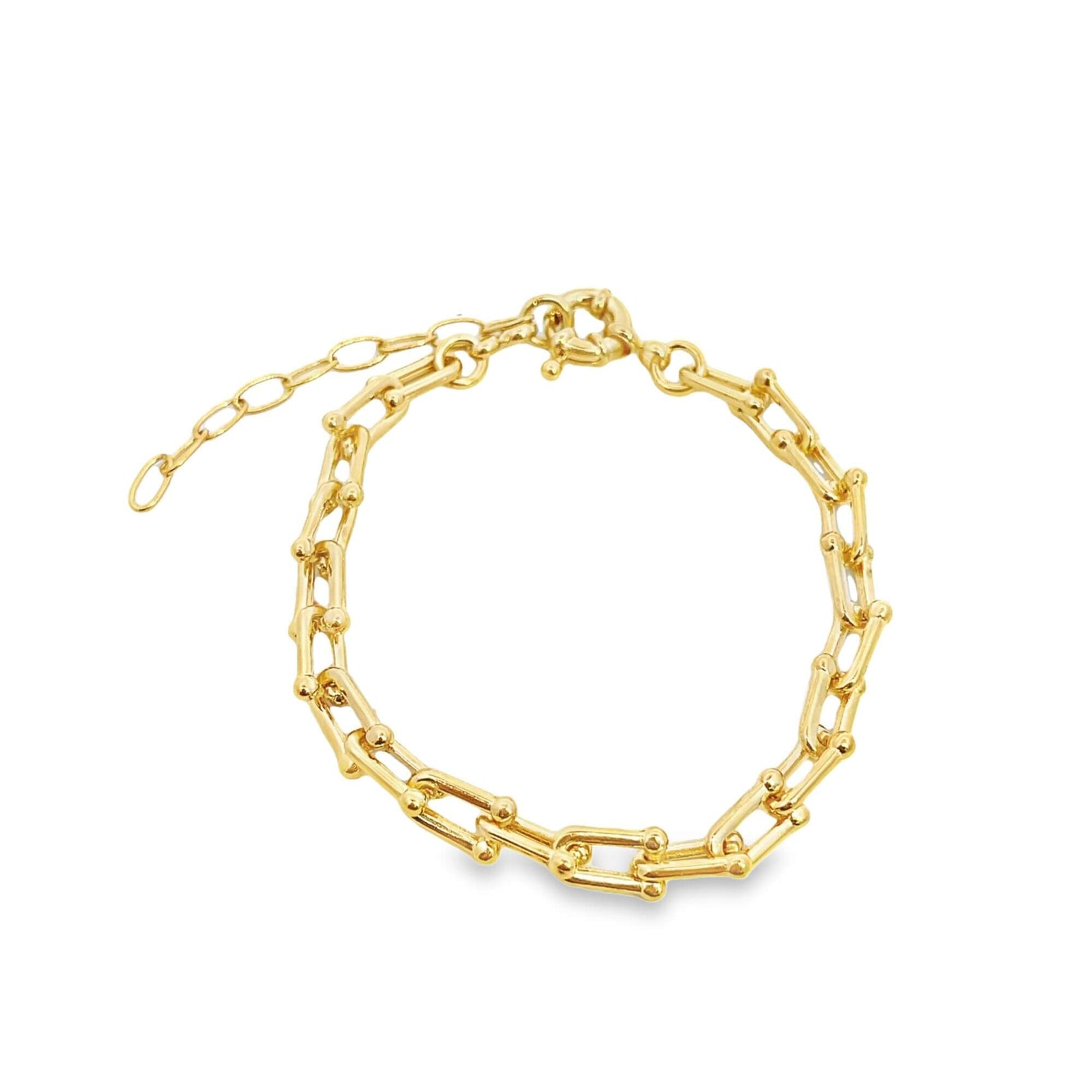 A gold chain link bracelet with U-shaped links rests on a plain white background.