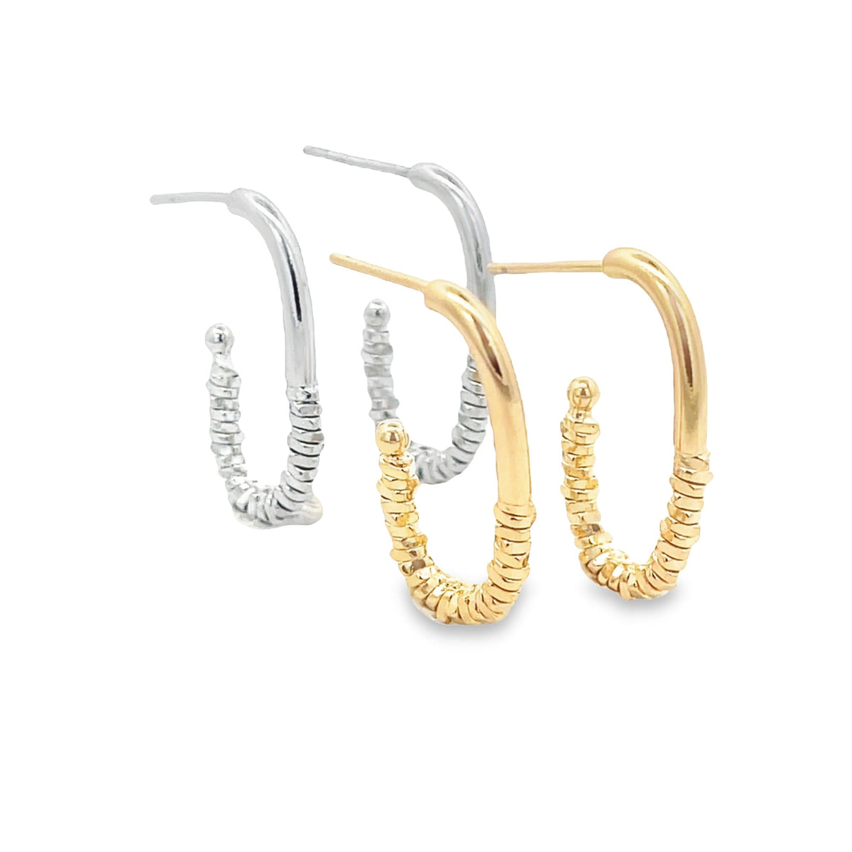 Two pairs of textured hoop earrings in silver and gold rest on a clean white background.